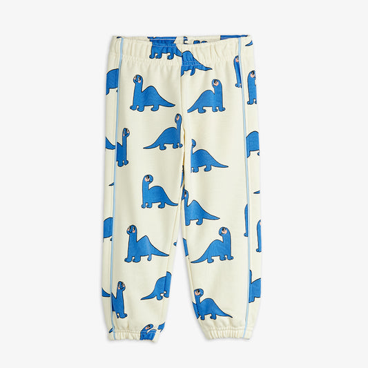 White pants with blue dinosaur pattern on a white background