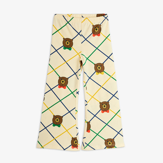 Pajama pants with bear pattern and colorful grid on a white background
