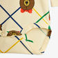 Fabric with teddy bear design and colorful lines on a white background