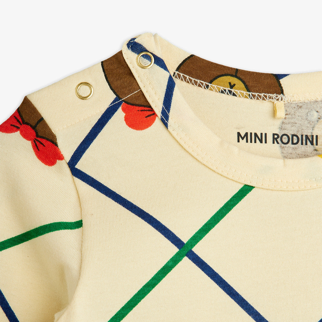 Children's outfit with colorful pattern and 'Mini Rodini' branding on a white background