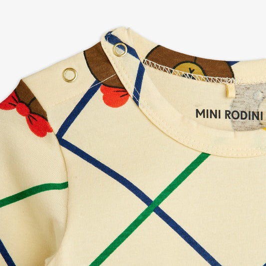 Children's outfit with colorful pattern and 'Mini Rodini' branding on a white background