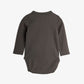 Dark gray ribbed baby onesie on a white background