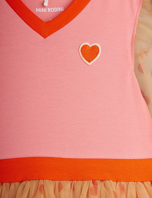 Pink dress with orange trim and heart design, featuring Mini Rodini branding.
