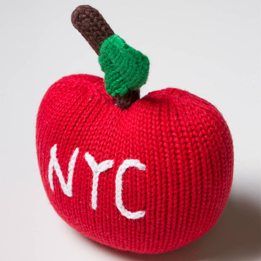 Knitted red apple with 'NYC' on a white background