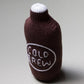 Knitted bottle rattle with 'Cold Brew' text on a gray background