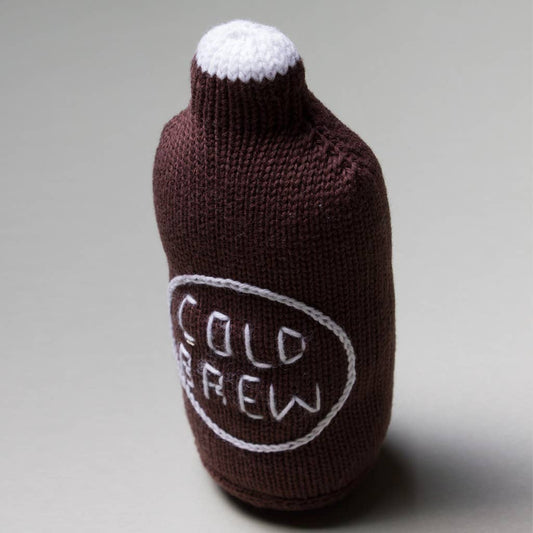 Knitted bottle rattle with 'Cold Brew' text on a gray background