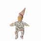 Fabric doll with floral onesie and pointed hat on a white background