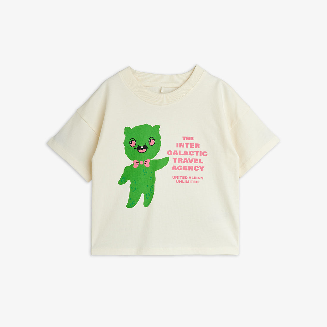 Beige t-shirt with a green character and text on a white background