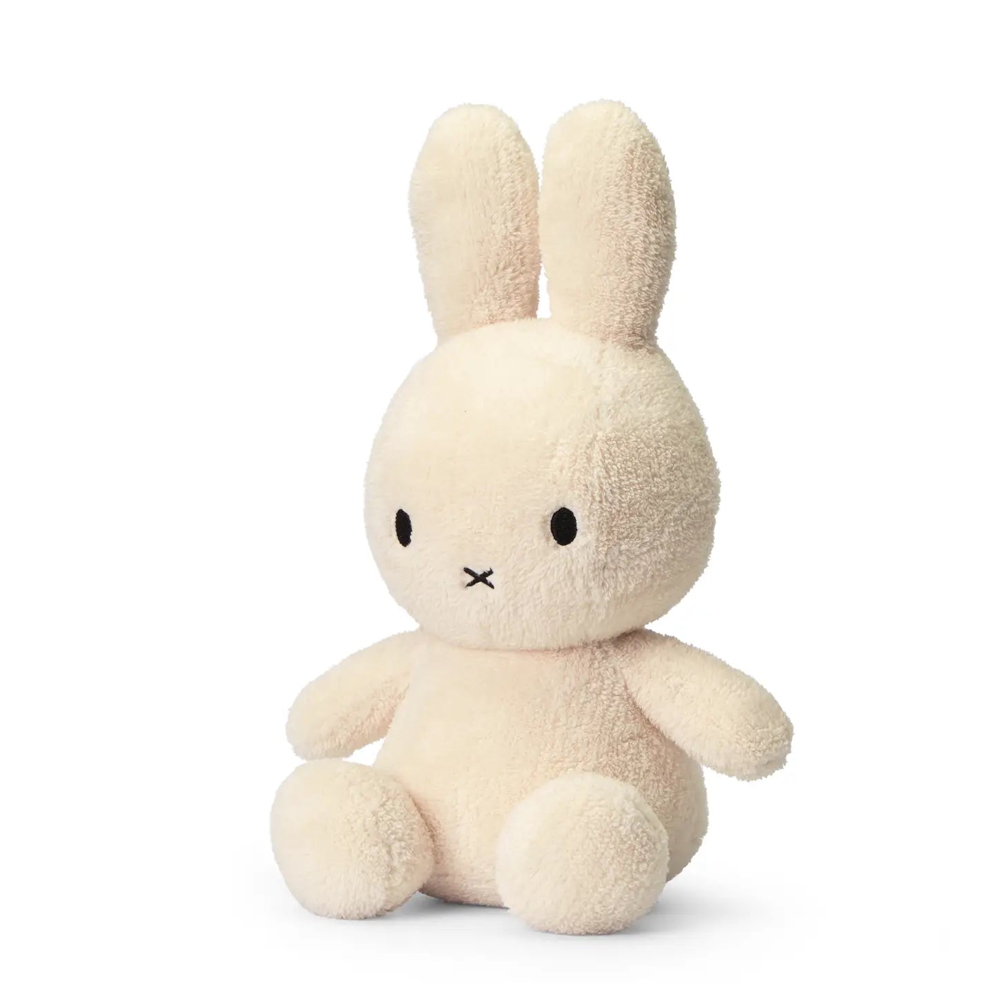 A Miffy Cream terry soft toy in the colour cream. This Miffy has black eyes and nose. It is 33 cm in height. It is made with 100% recycled filling. The background is white. 