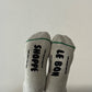 Gray socks with 'SHOPPE' and 'LE BON' text on a white background