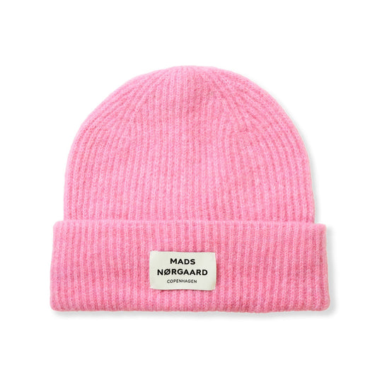 Pink beanie with a brand label on a white background