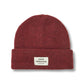 Red beanie with a brand label on a white background