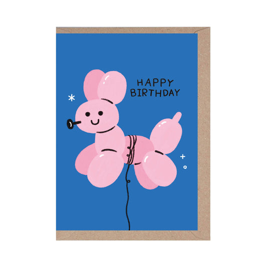 Greeting card with a pink balloon animal and 'Happy Birthday' text on a blue background