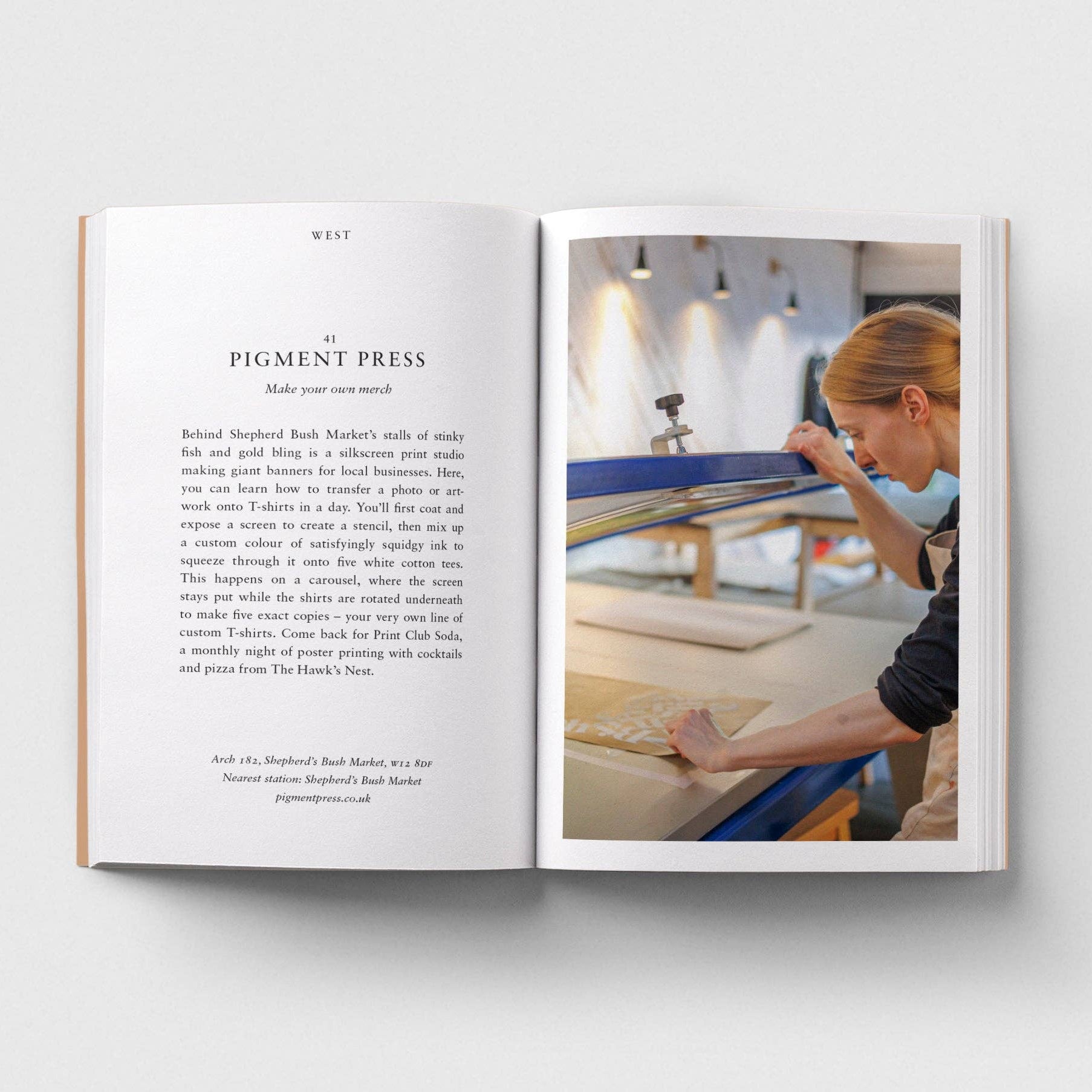 Open book showing a page with text and an image of a person working on a craft project.