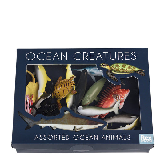 Box of assorted ocean animals toys with 'Ocean Creatures' text on a white background