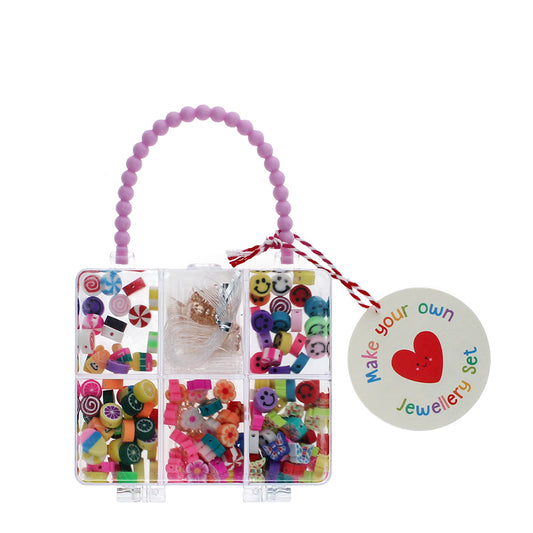 Jewelry-making kit with colorful beads and tools on a white background