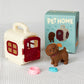 Toy pet house with a toy dog and accessories on a textured surface