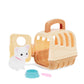 Toy pet carrier with a small white dog figure and accessories on a white background