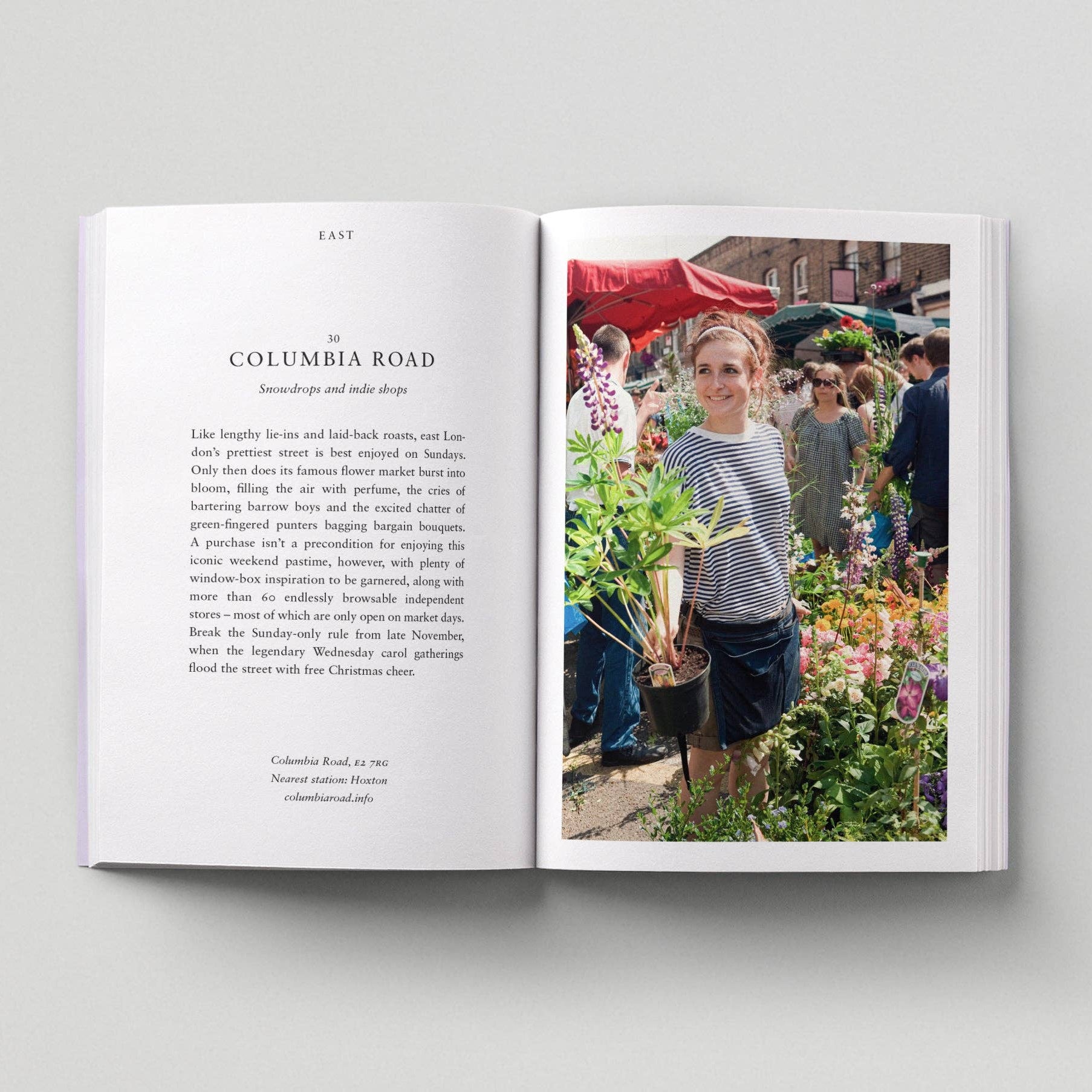 Open book with text and a photo of a woman at Columbia Road market.