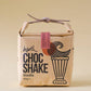 Kraft paper packaging of a vanilla chocolate shake with a handle on a beige background