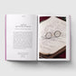 Open book with text and an image of round glasses on a white background