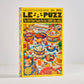 LE PUZZ puzzle box with colorful graphics on a white background
