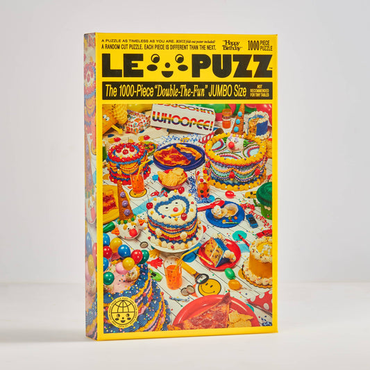 LE PUZZ puzzle box with colorful graphics on a white background