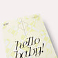 Yellow baby shower invitation with 'hello baby!' text on a white background