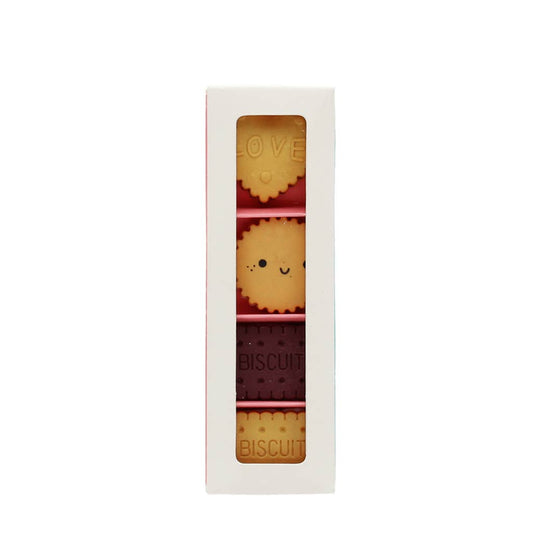 Set of erasers with cute designs in a white box on a white background