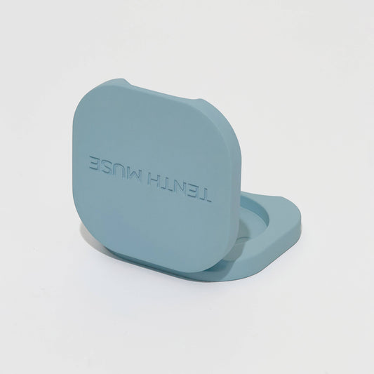 Teal silicone product with 'TENTH Muse' branding on a light gray background
