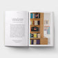 Open book showing text and a photograph of a bookshelf with books.