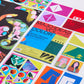 Collection of colourful posters and booklets with geometric designs and vibrant colors.