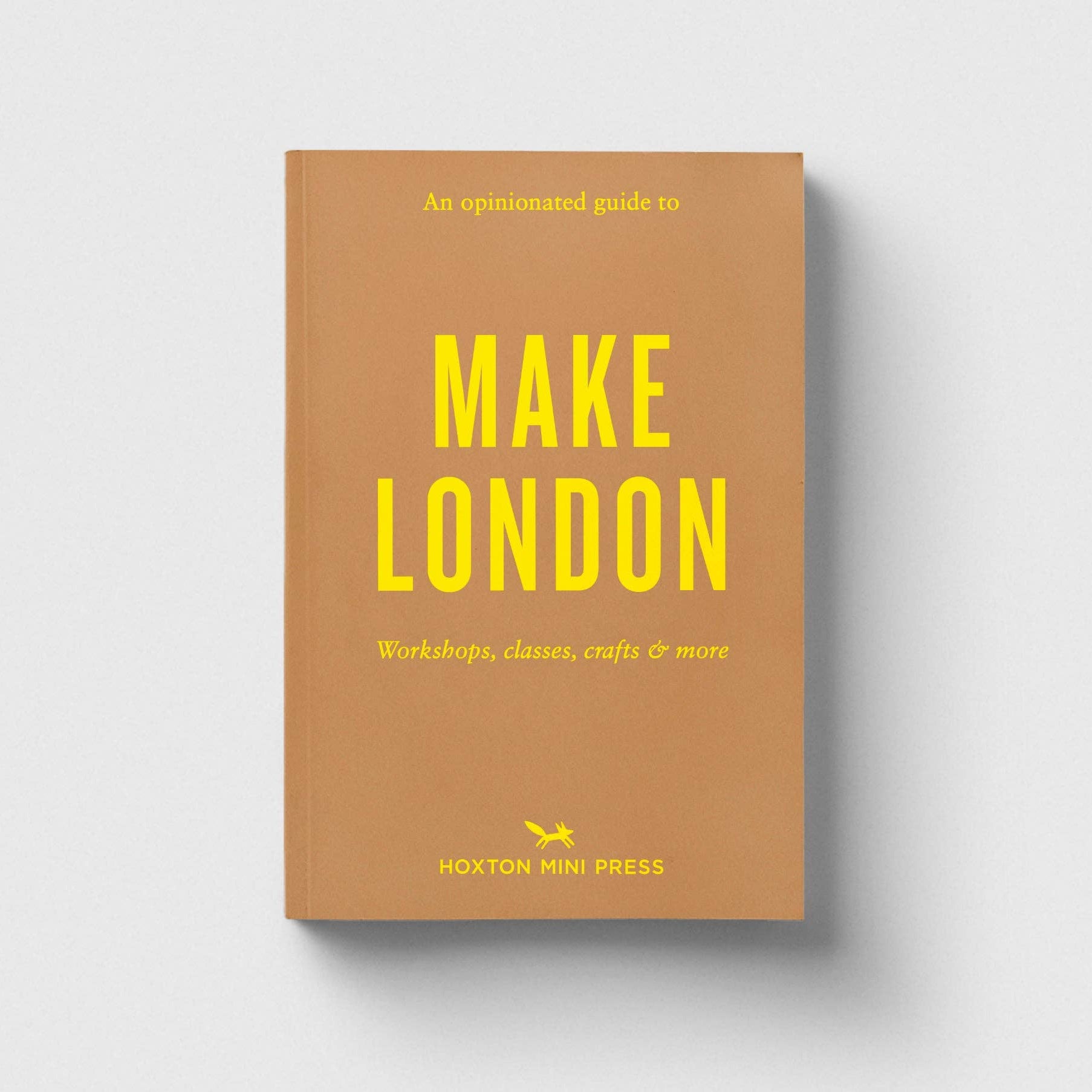 Book cover of 'Make London' with yellow text on a brown background
