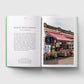 Open book showing text on one page and a photograph of Ridley Road Market on the other.