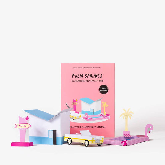 Palm Springs travel guidebook with miniature models on a white background