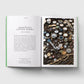 Open book showing a page about Bermondsey Antique Market with an image of vintage jewelry.