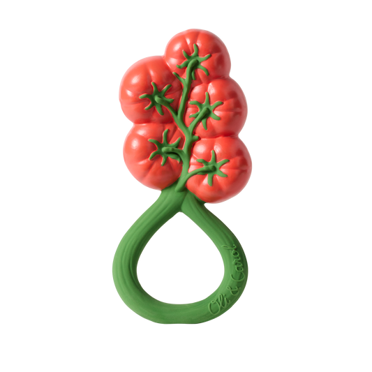 Teething ring designed like a tomato on a white background