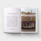 Open book showing text and a photograph of a building