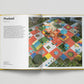 Open book showing a colorful playground design with text on a white background