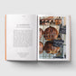 Open book showing a page with text and an image of bread loaves on a rack.