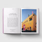 Open book showing a page with text and an image of a colorful building.