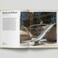 Open book showing a photograph of a playground with rocks and a slide, and text on a white background.