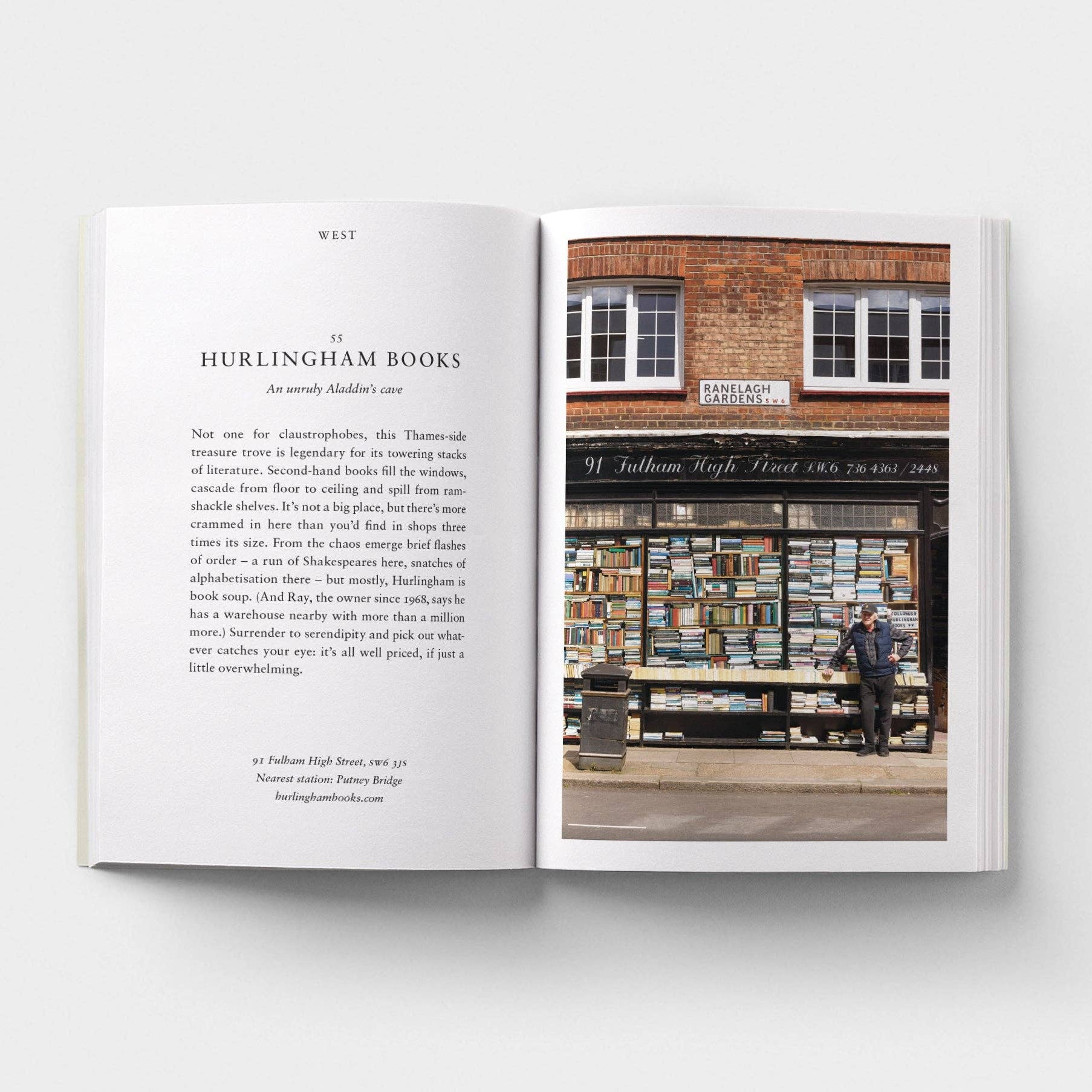 Open book showing text and a photograph of a bookstore exterior.
