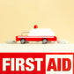 Red and white toy ambulance on a beige background with 'FIRST AID' text.
