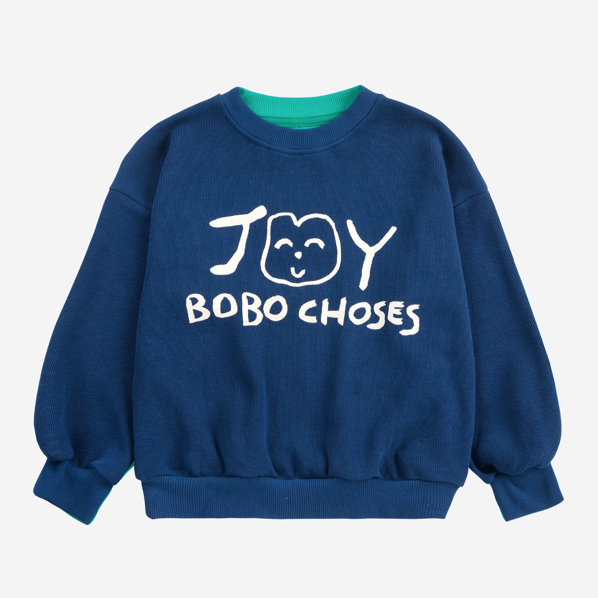 Bobo Choses Joy Sweatshirt in deep blue with a contrasting green neckline. Features a playful hand-drawn-style 'JOY' graphic with a smiling face and 'BOBO CHOSES' text on the front. Designed with a relaxed fit, ribbed cuffs, and hem for a cosy feel.