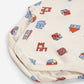 Folded fabric with colorful toy patterns on a white background