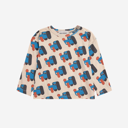 Long-sleeve shirt with truck pattern on a beige background