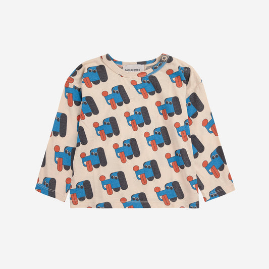 Long-sleeve shirt with truck pattern on a beige background