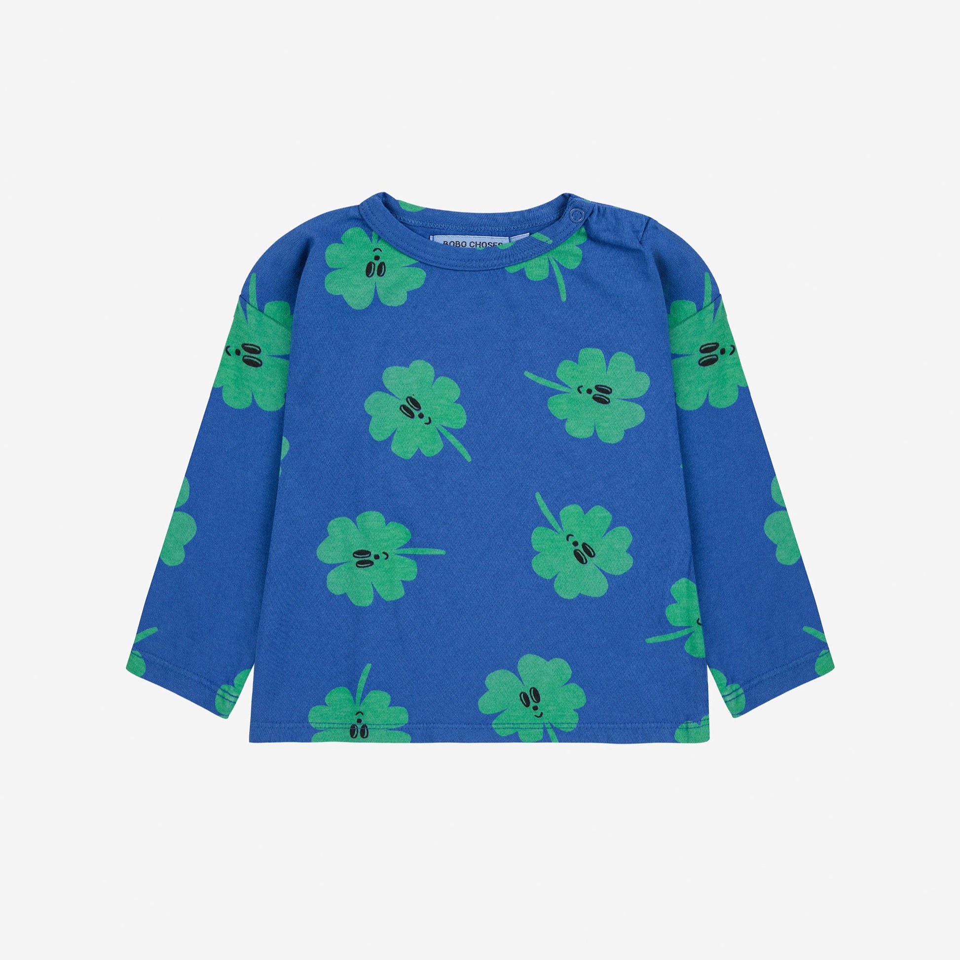 Blue long-sleeve shirt with green clover pattern on a white background