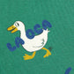 Pattern of cartoon ducks on a green background with 'La Casa' branding.